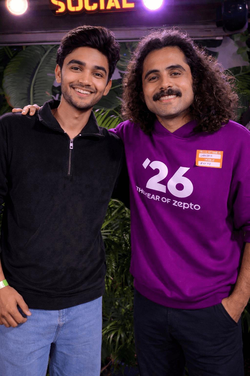 Two collaborators at a social gathering